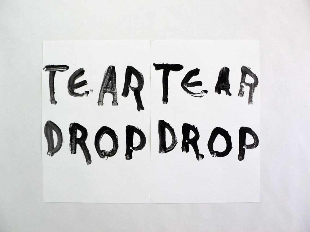 ink drawing on card that says "Tear Tear DRop Drop"