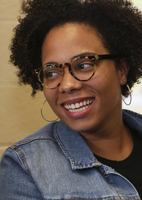 an African American woman with glasses
