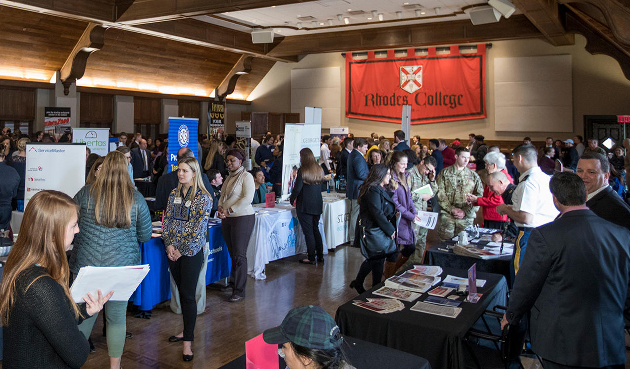 students meet employers in a large ballroom