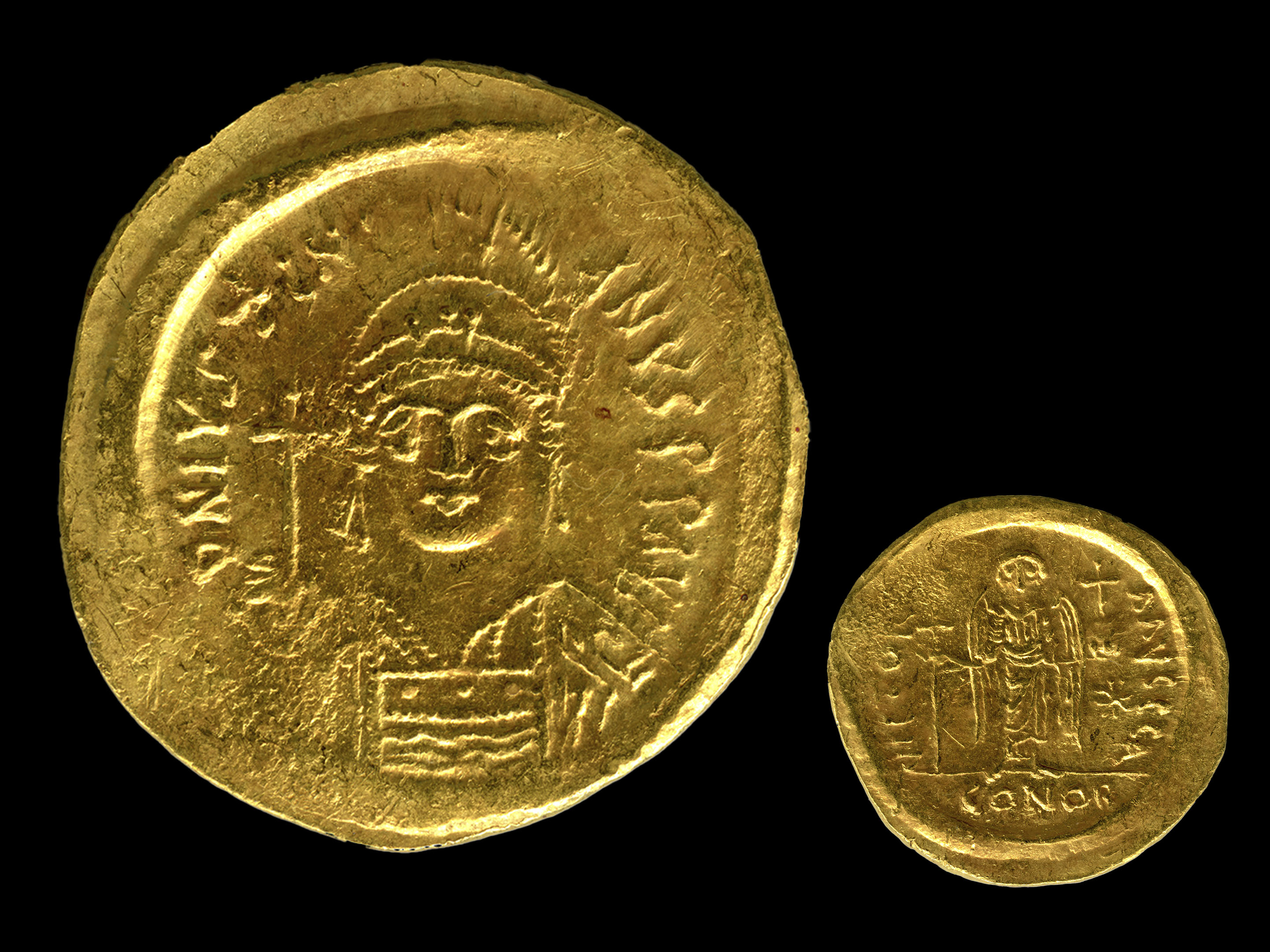 the obverse and reverse of a gold Justinian coin