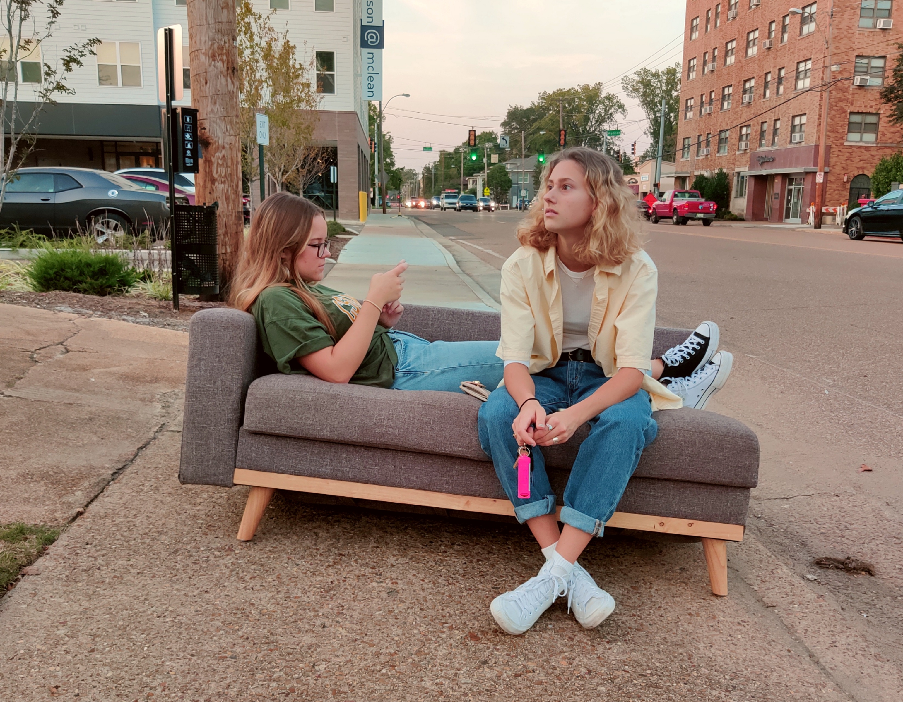 Two girls sitting on a couch on the sidewalk in Memphis.  #7