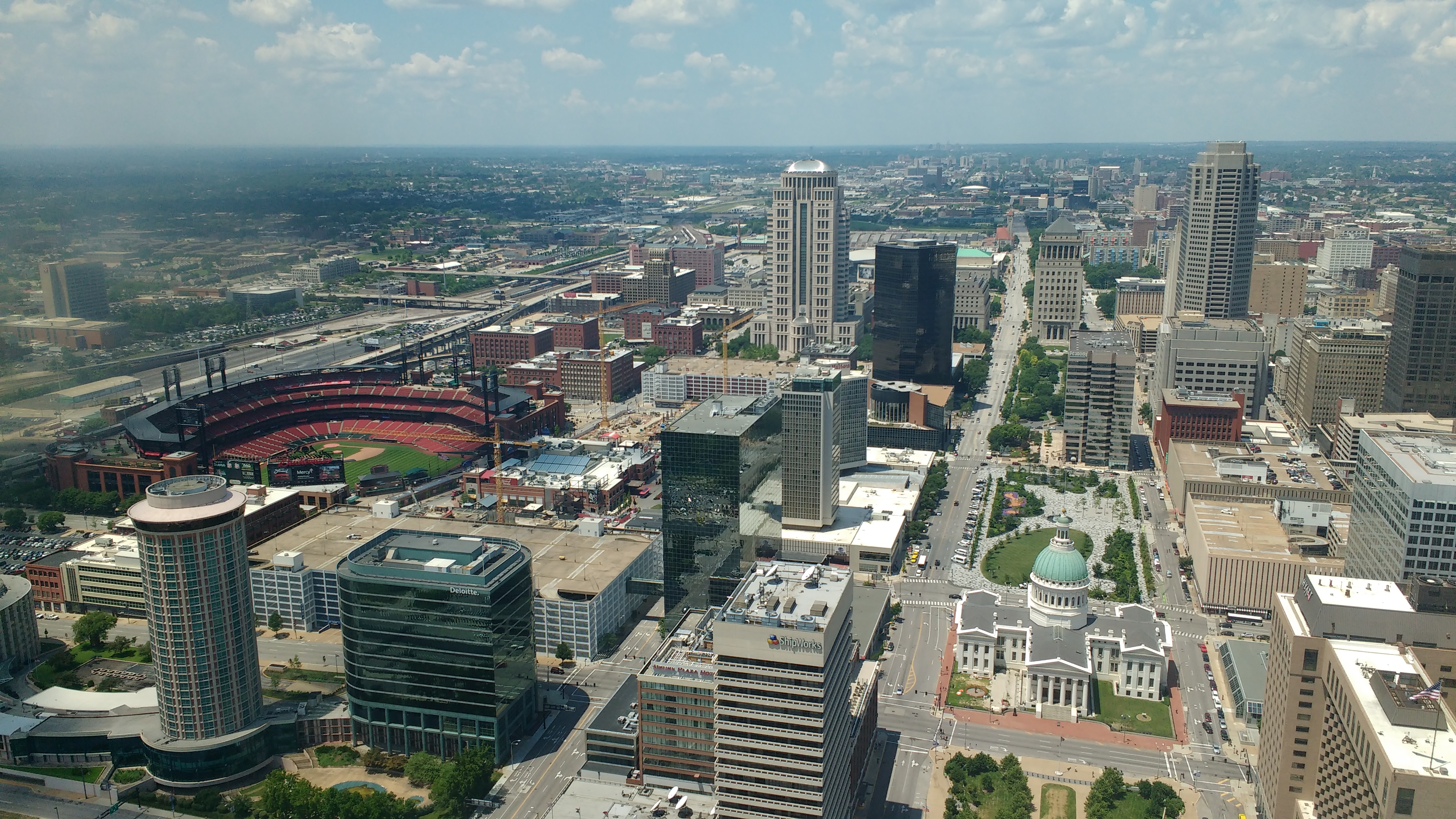 A bird's eye view of the city on a sunny day.