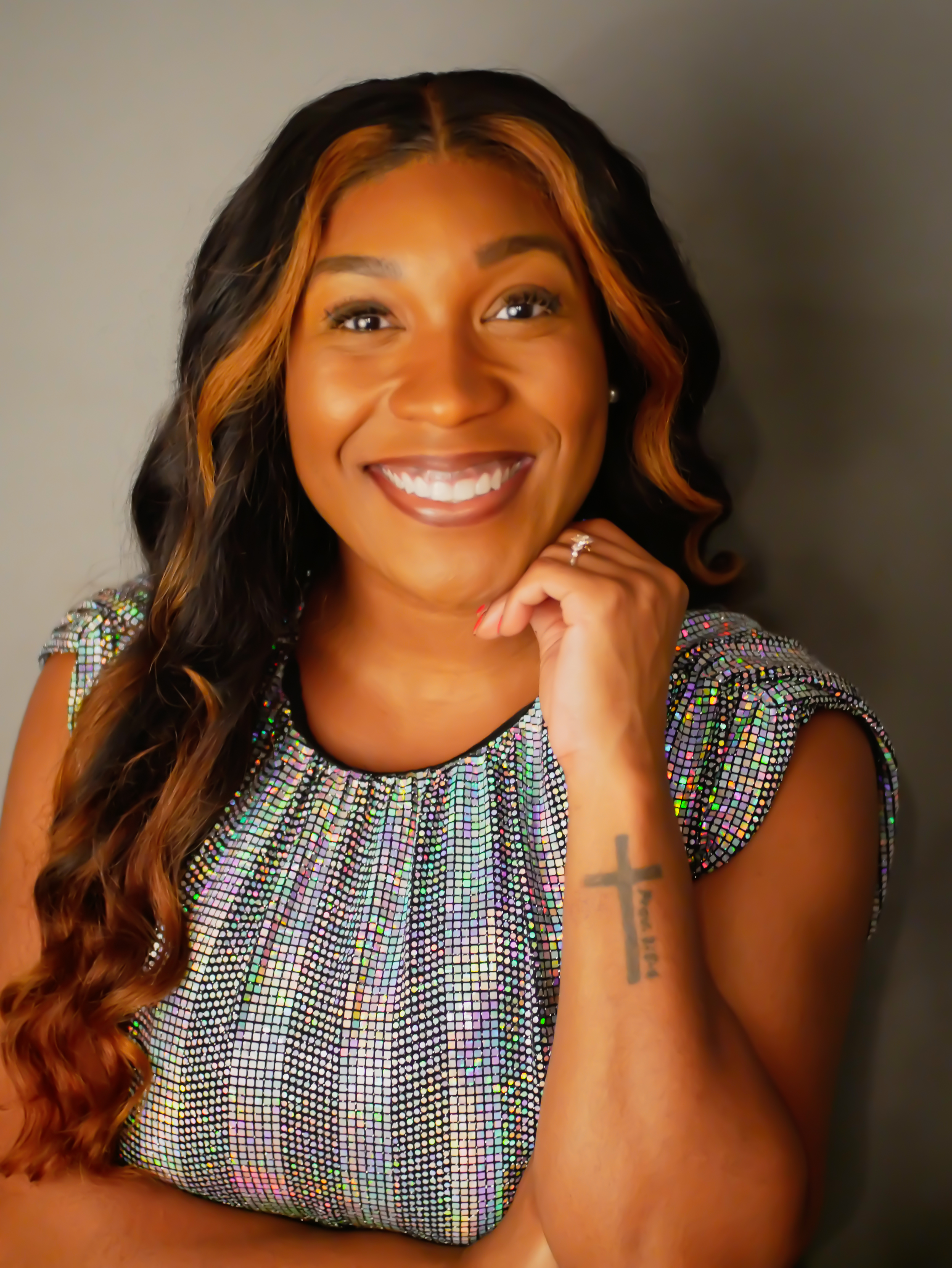 an African American woman with long wavy hair