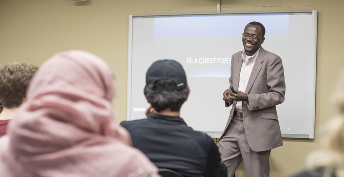 a professor in front of a class