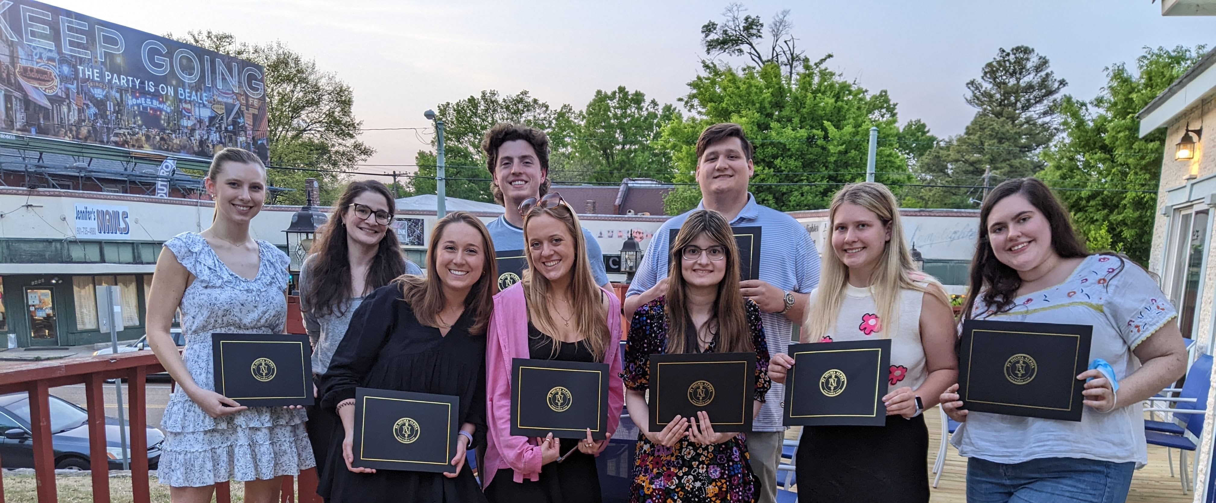 a group os students holding awards