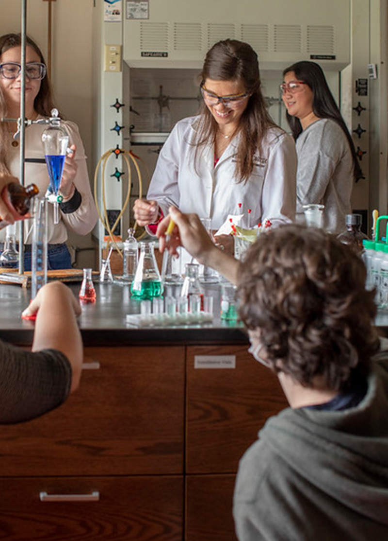 a professor and students in a lab