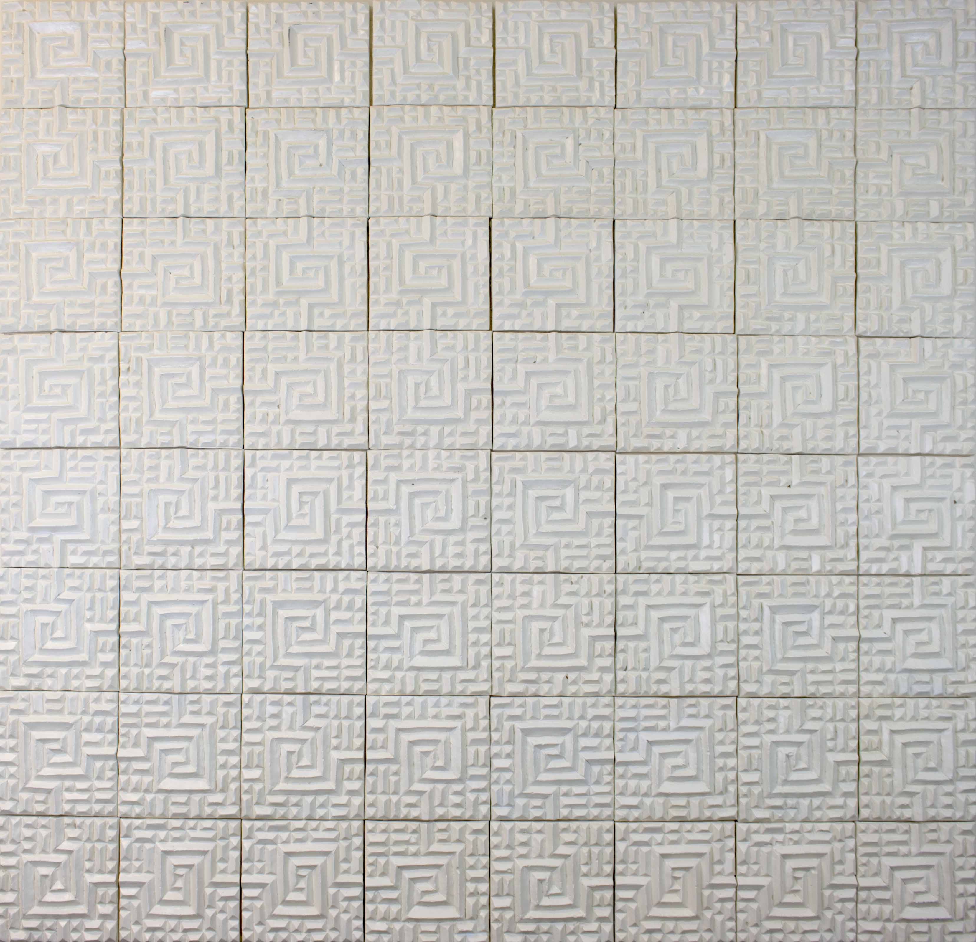 This is a white tessellation of repeating decorated squares. It has eight tiles going down and across. The base plywood board is painted white. 