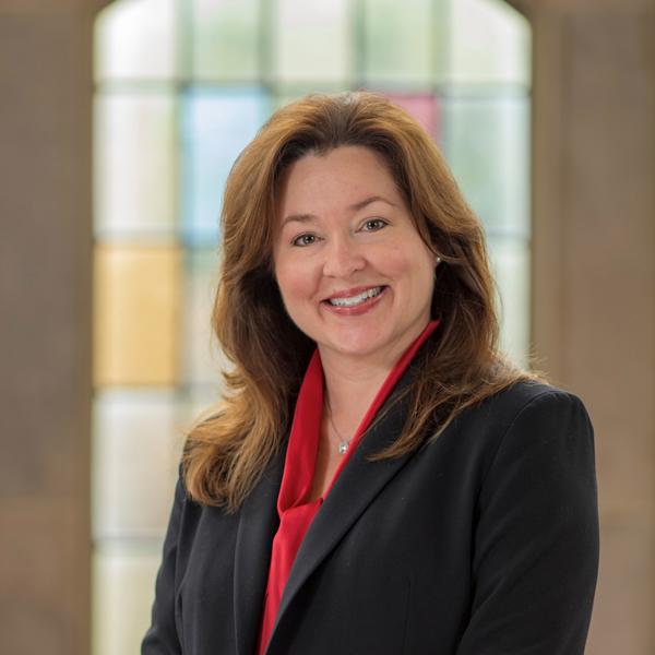 Melissa Butler, Director, woman wearing black blazer