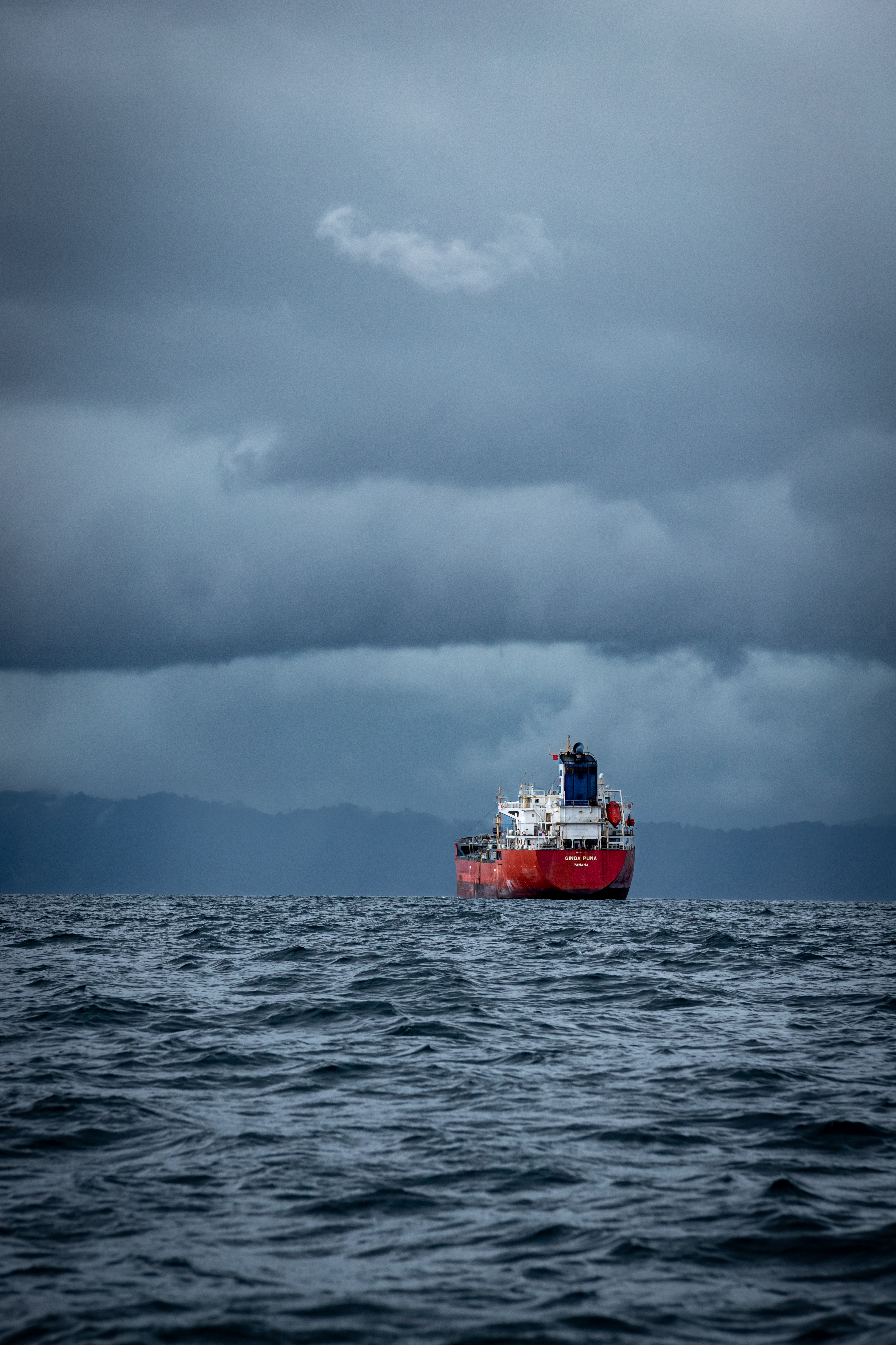 a large container ship and a stormy sky