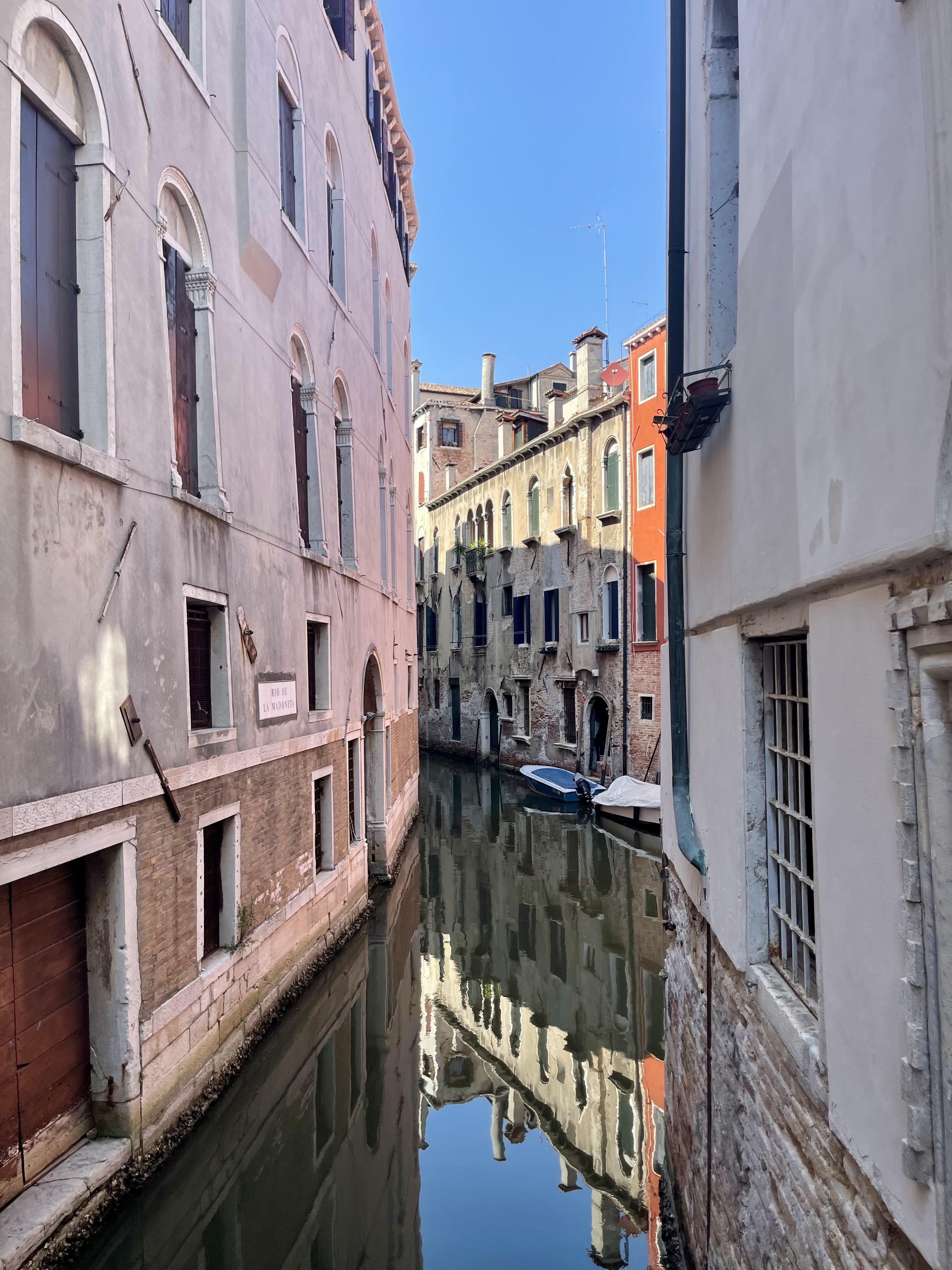 a narrow canal between old buildings