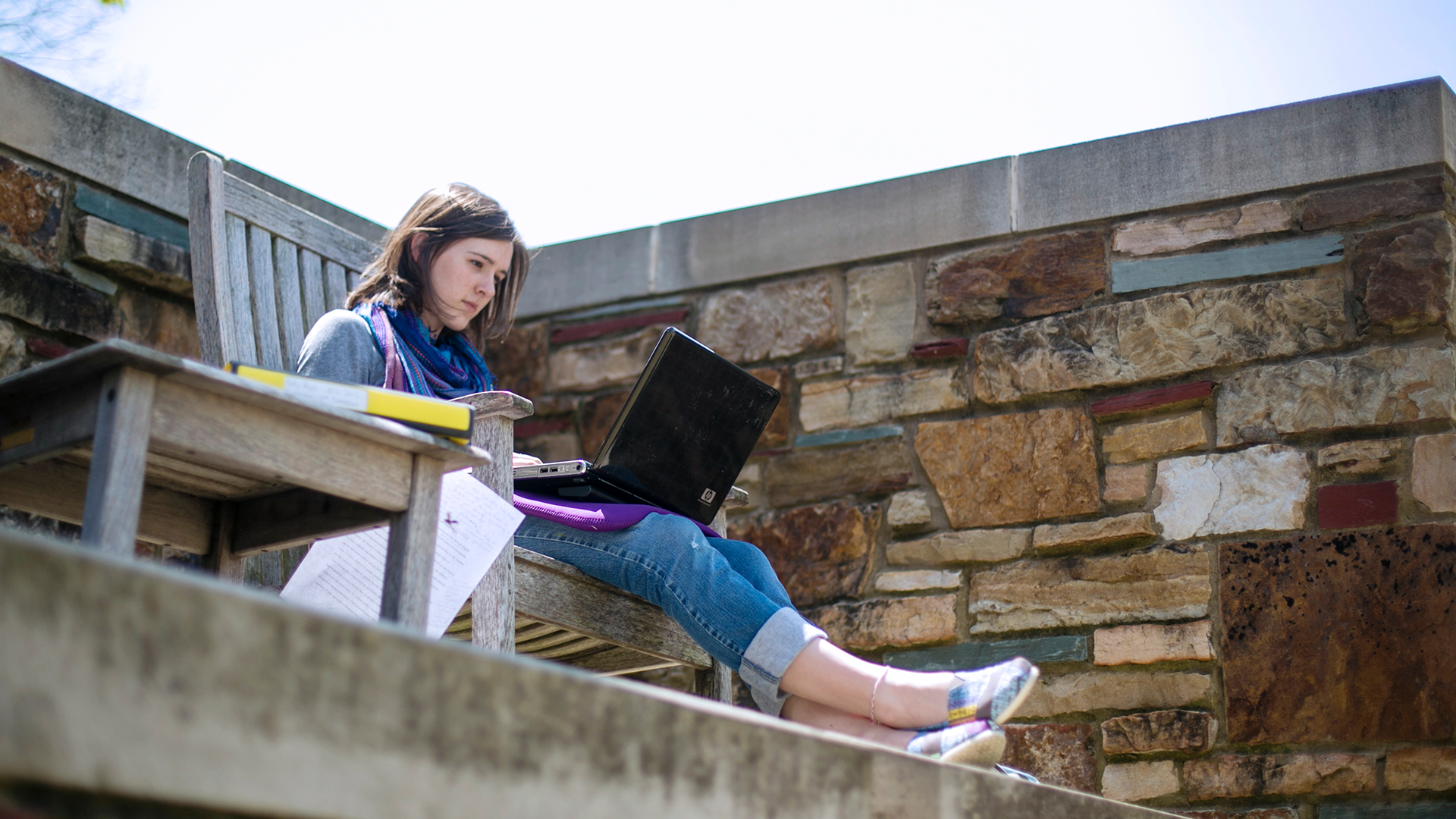 Student with a laptop on campus