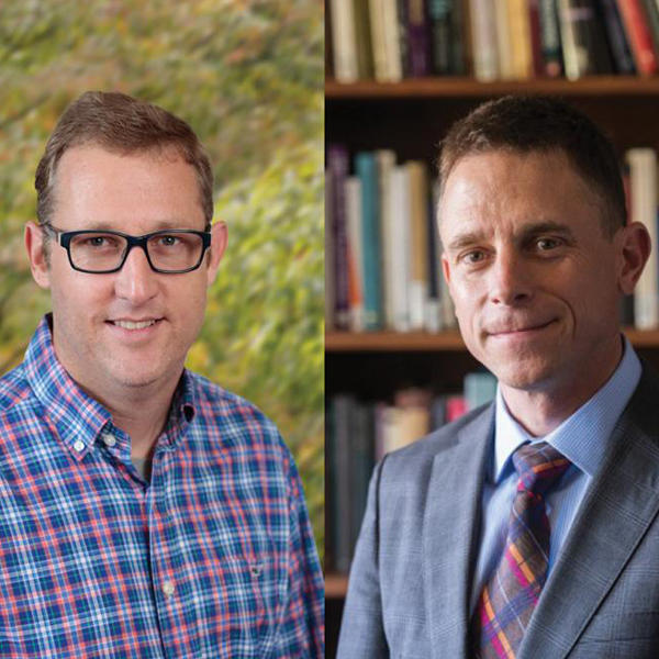 two male professors look at the camera