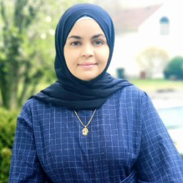 a young woman wearing a blue hijab