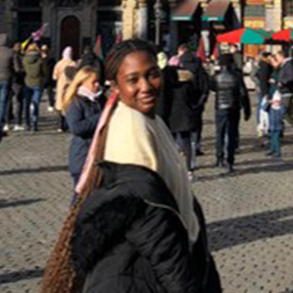 a young Black woman with long hair pulled back