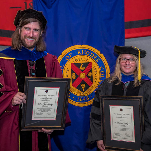 Zach Casey and Rebecca Finlayson hold Clarence Day awards