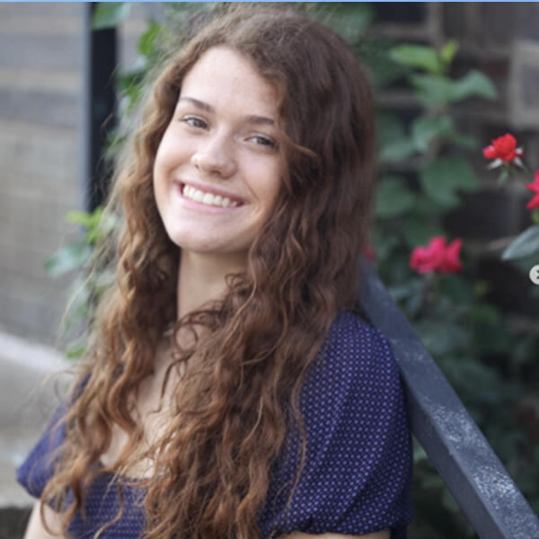 a young woman smiles at the camera