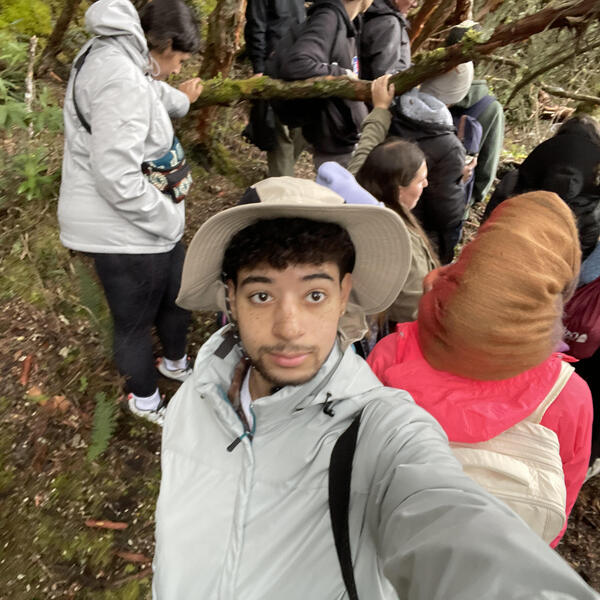 A young man in a forest with a group of students, John Barnett| Memphis, TN | '27