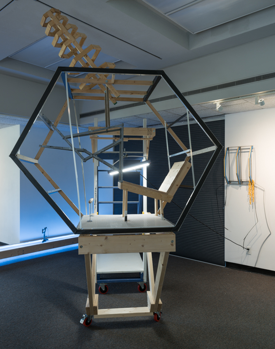 Sculpture with wood, light, found objects and mixed media.