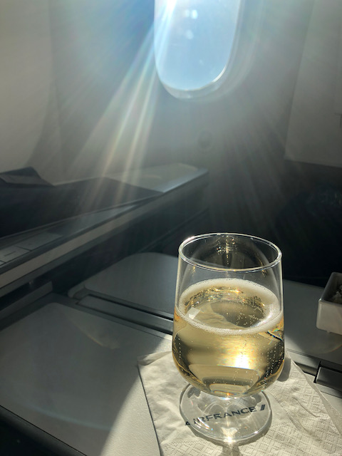 a glass of champagne rests on a table