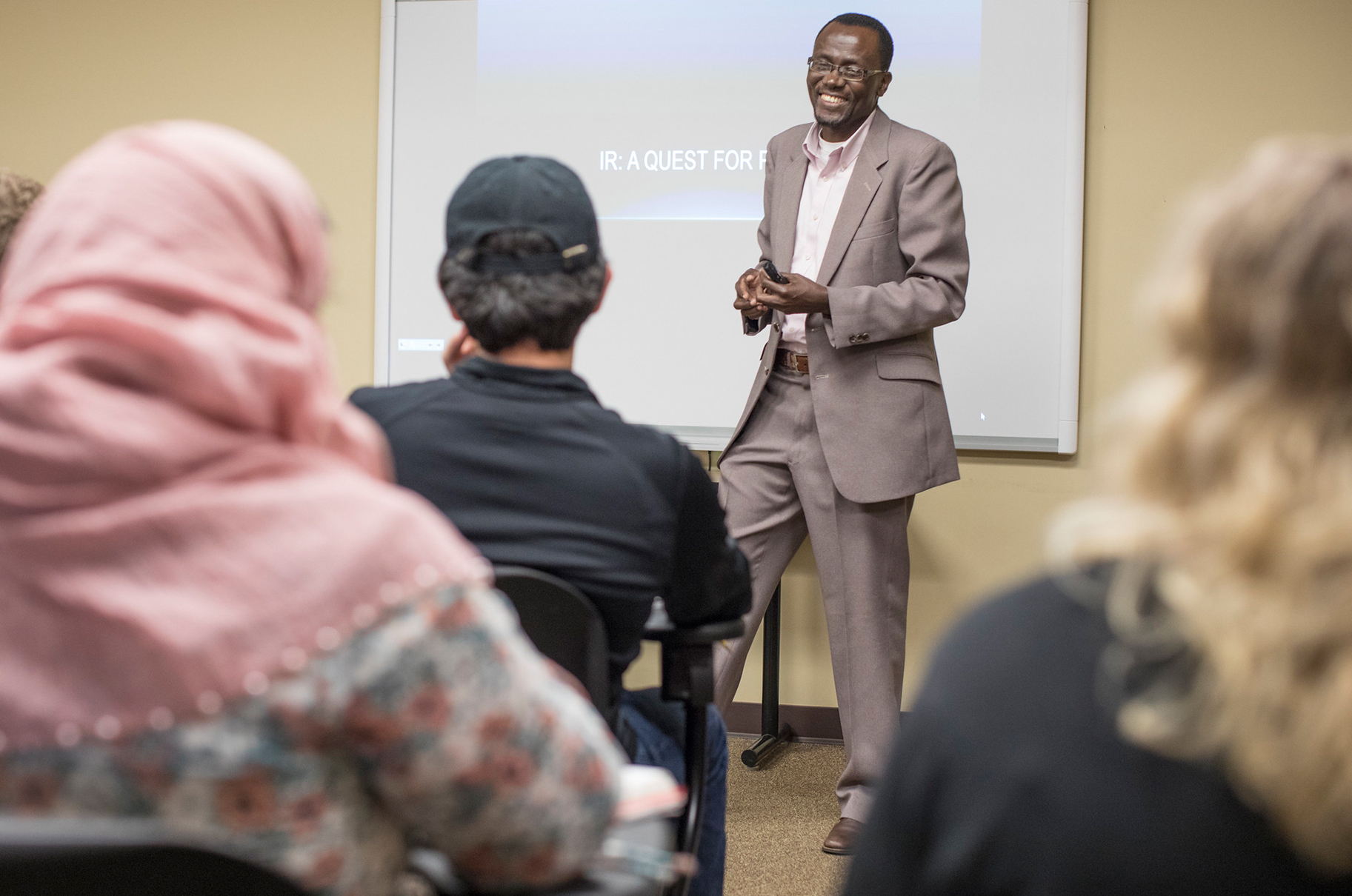 a professor in front of a class