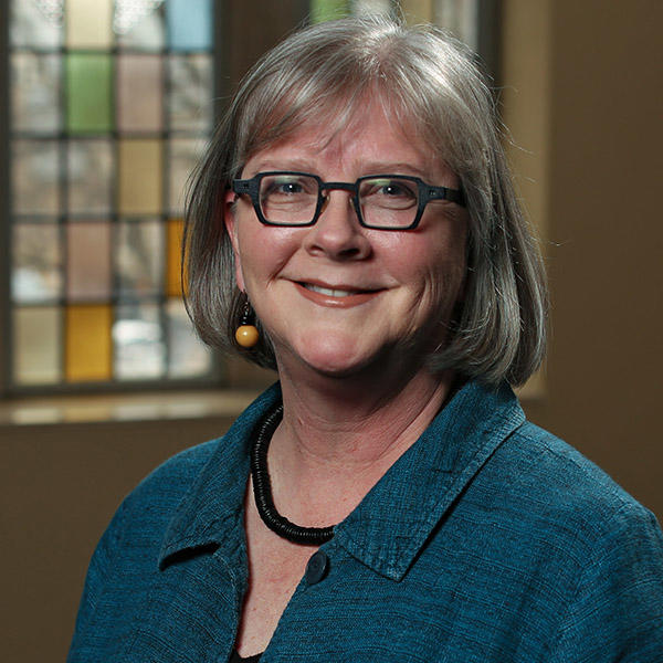 a woman in glasses