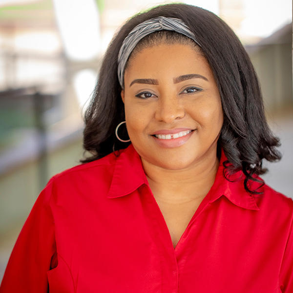 an African American woman with shoulder length dark hair